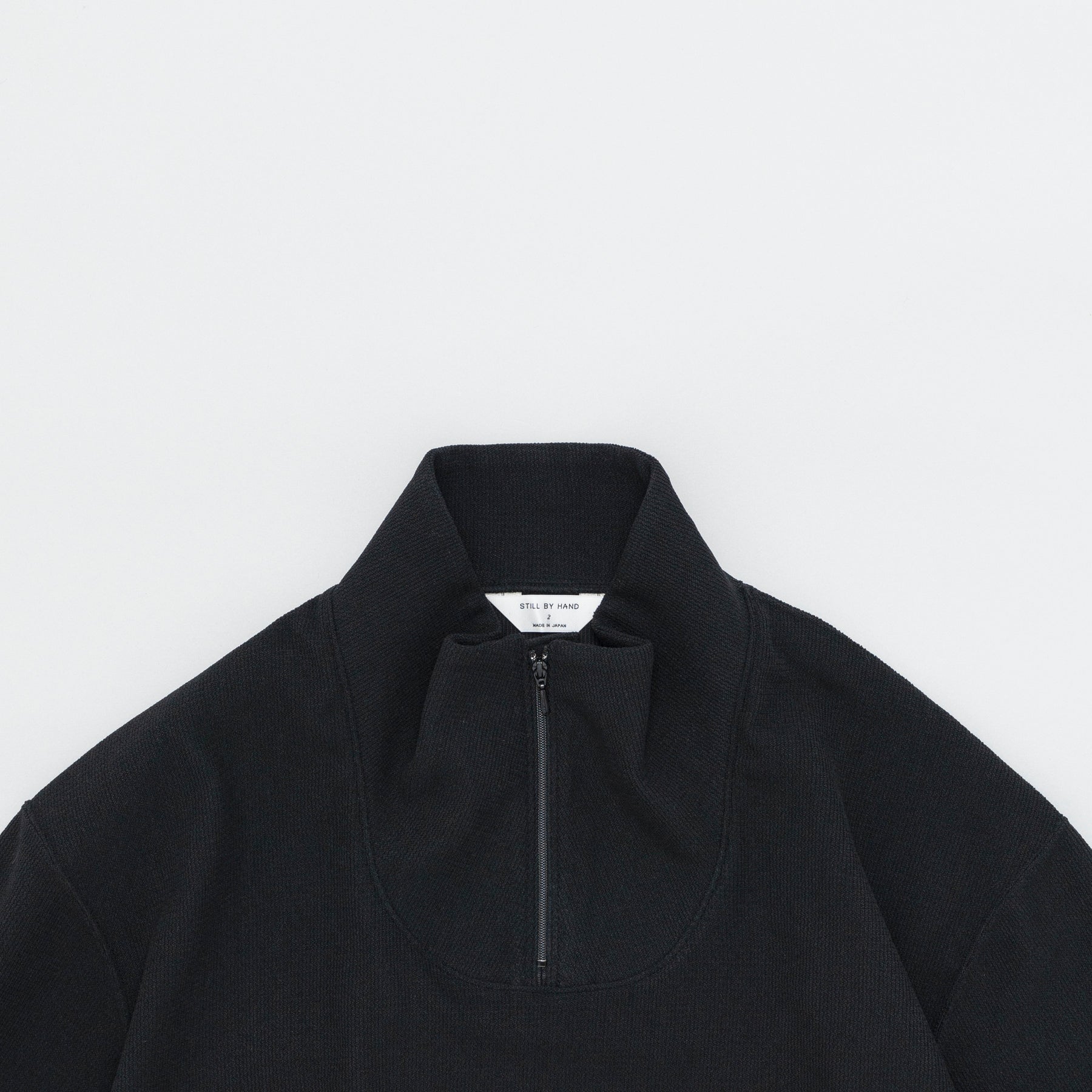 STILL BY HAND High Neck Zip Up Jumper | Black LEO BOUTIQUE