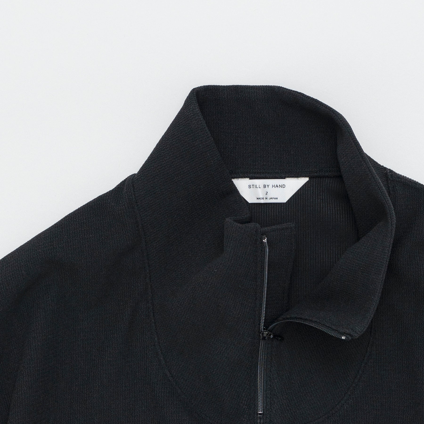 STILL BY HAND High Neck Zip Up Jumper | Black LEO BOUTIQUE