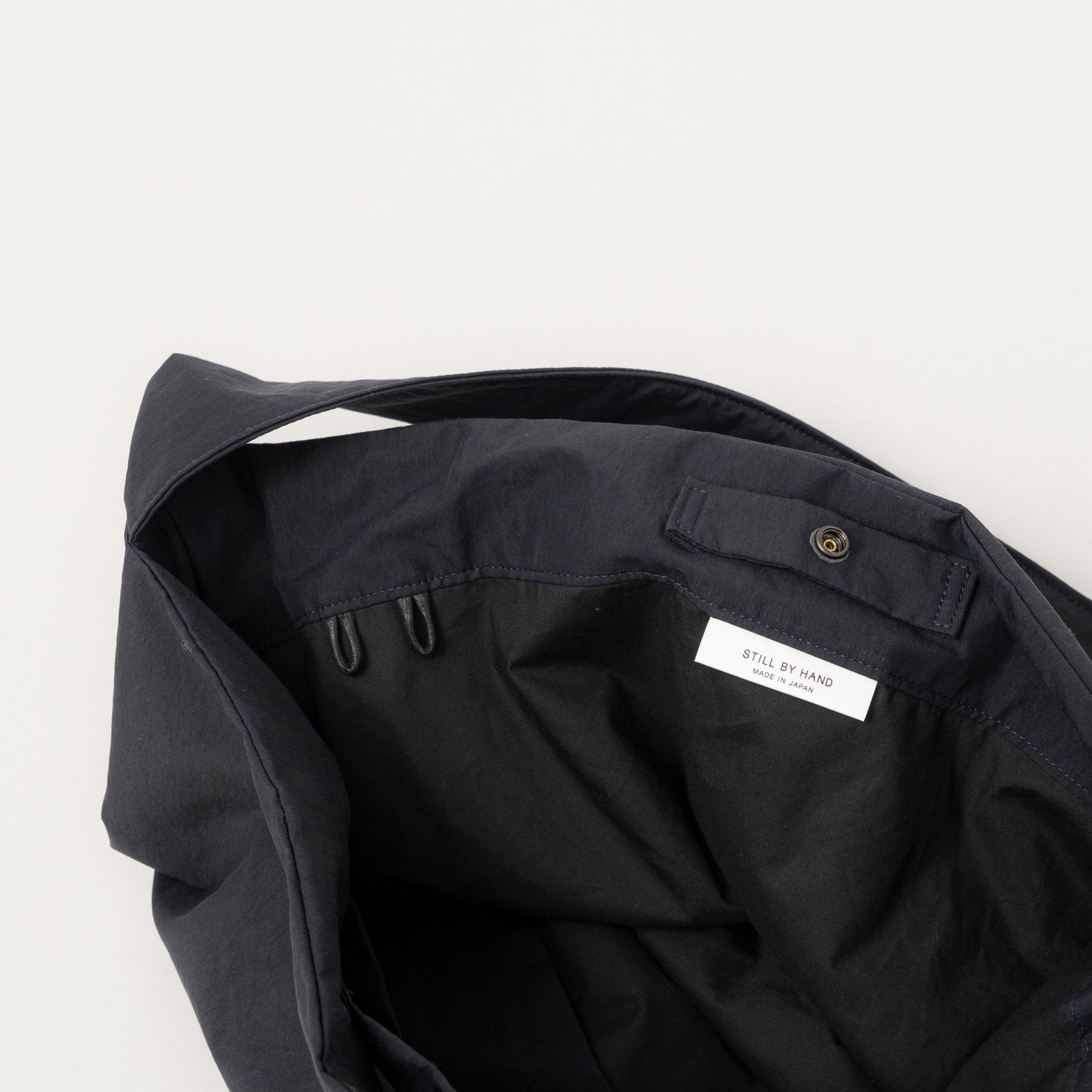 STILL BY HAND Padded Crossbody Bag | Ink Black LEO BOUTIQUE